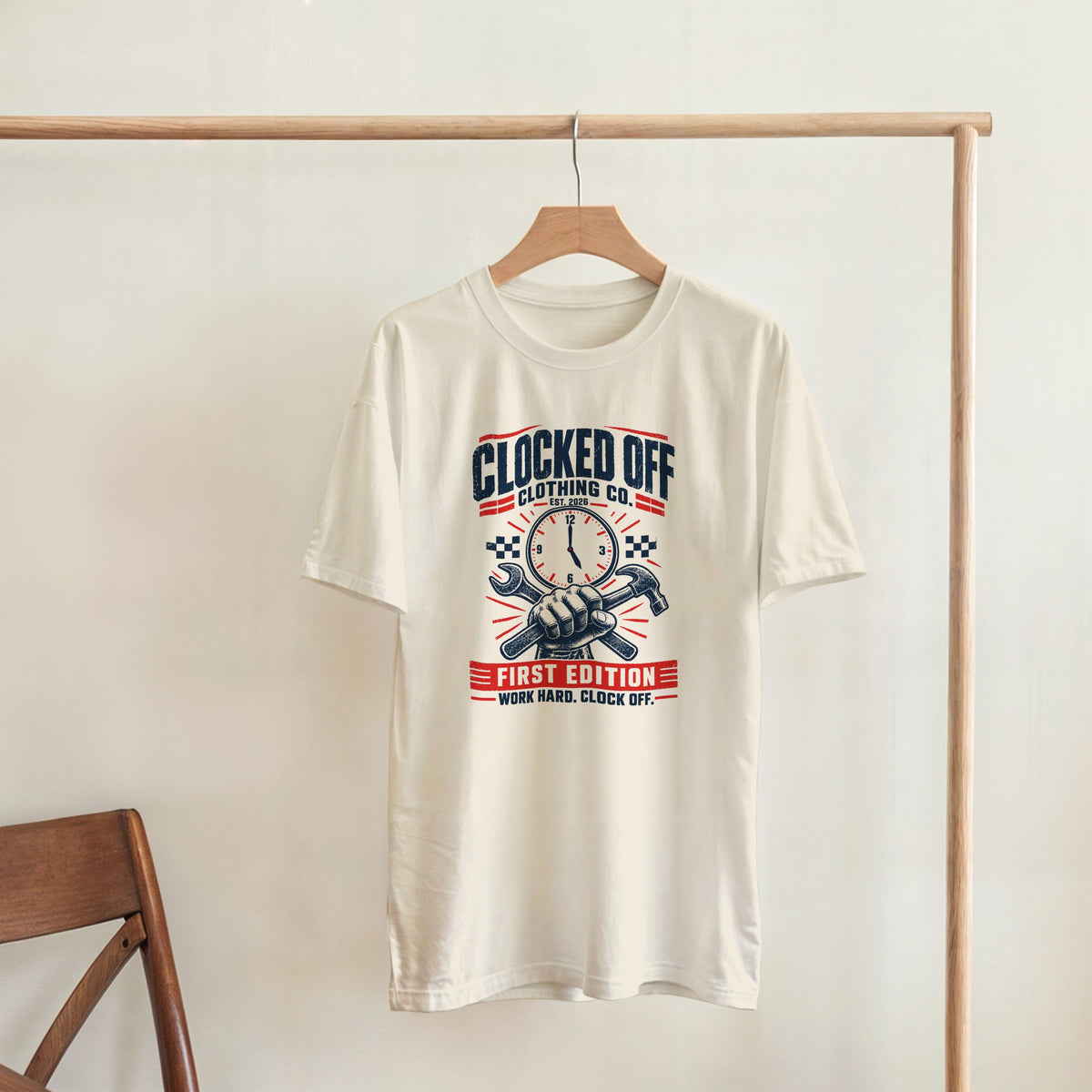Natural First Edition T-shirt hanging on a rail