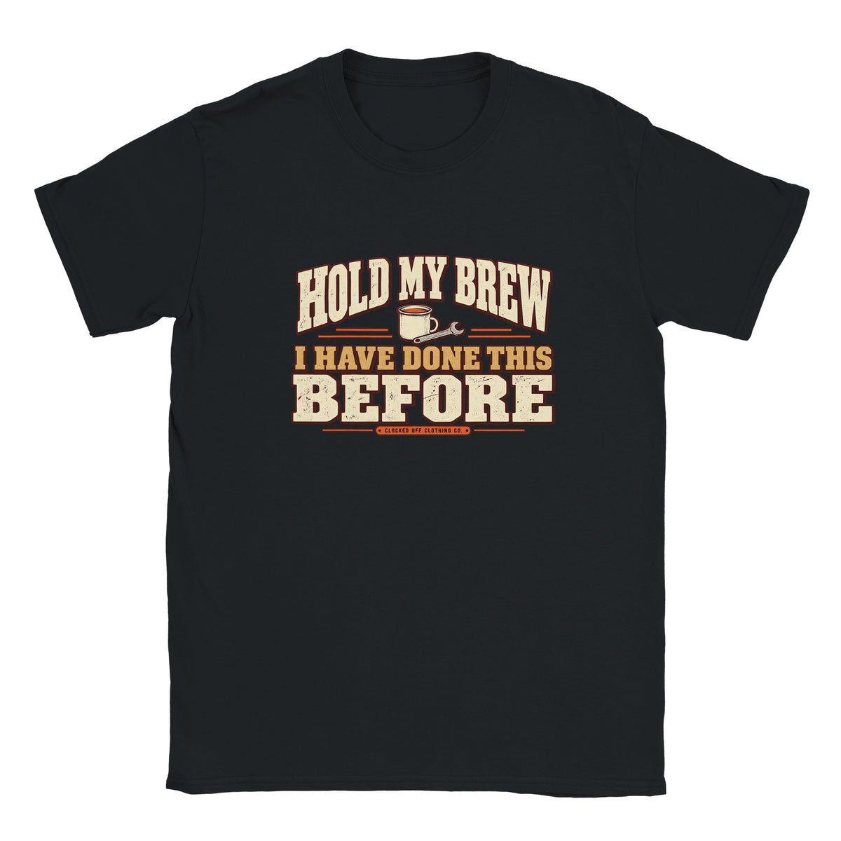 Front of a black T-shirt with ‘Hold My Brew, I Have Done This Before’ lettering, a mug and spanner graphic, and Clocked Off Clothing Co. branding.