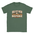 Front of a military green T-shirt with ‘Hold My Brew, I Have Done This Before’ lettering, a mug and spanner graphic, and Clocked Off Clothing Co. branding.